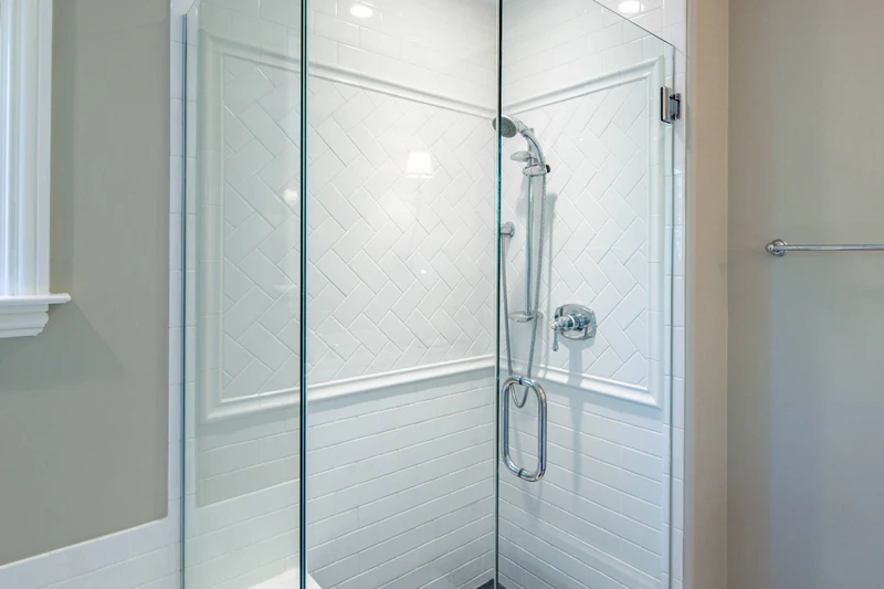 The primary en suite bathroom also has a beautifully tiled, walk-in shower.