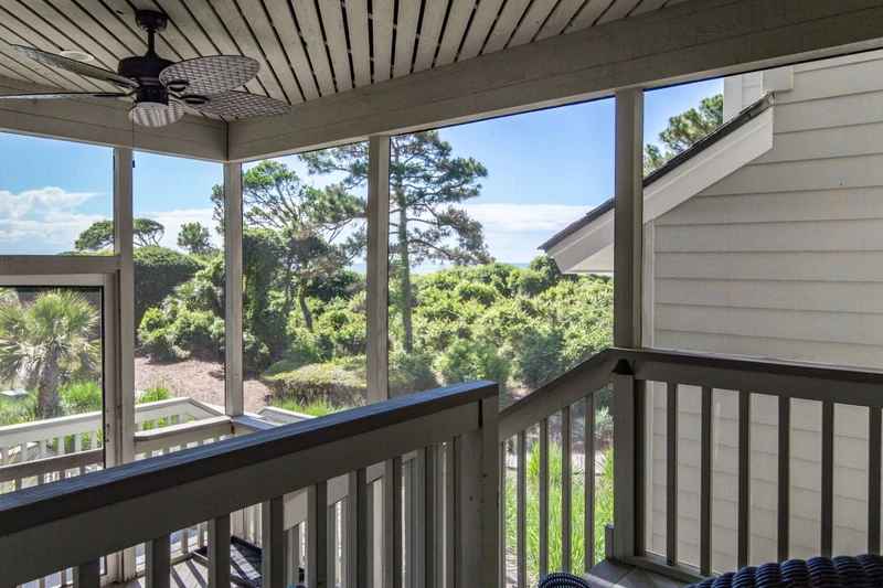 The screened porch also connects to the boardwalk behind the villa, which connects you to the beach.
