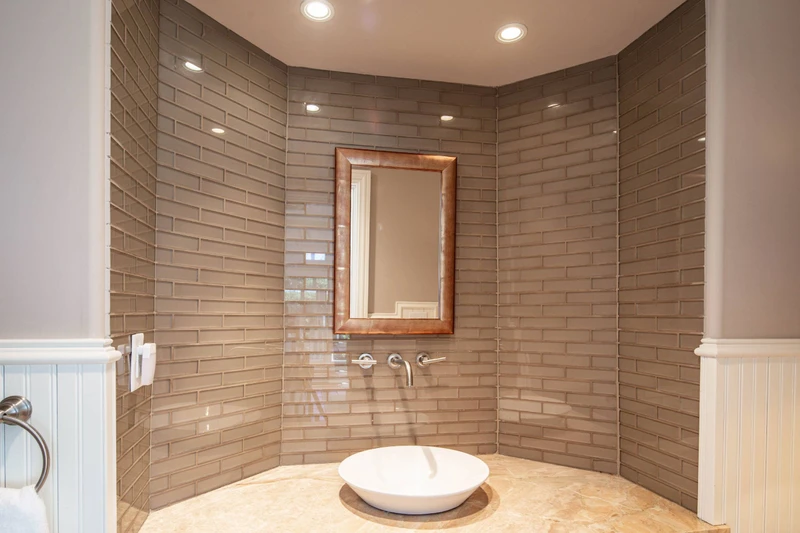 This half bathroom is located in the sunroom.