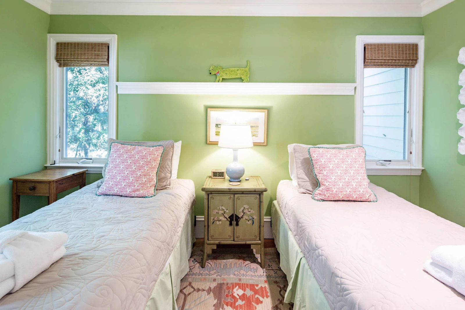 The twin suite features two twin beds and night stands with a reading lamp.