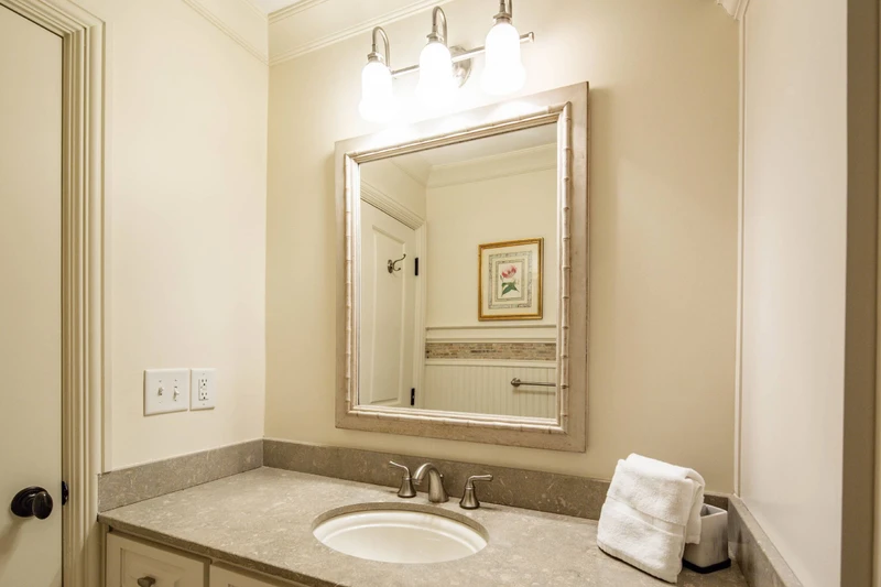 The twin en suite bathroom is accessible from the hall and the twin suite.