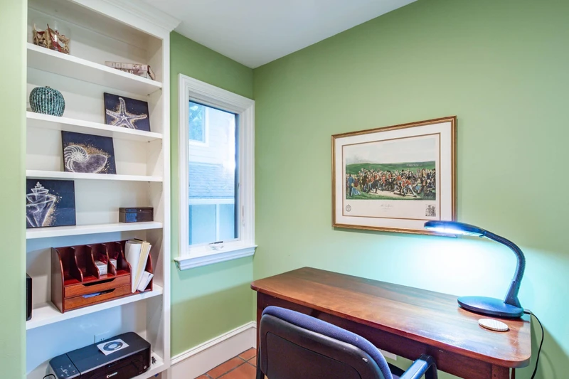 This office is located on the lower level of the home, near the front door and foyer.