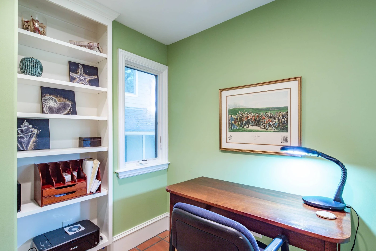 This office is located on the lower level of the home, near the front door and foyer.