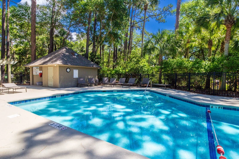 The community pool Is located behind and across the street from the villa.
