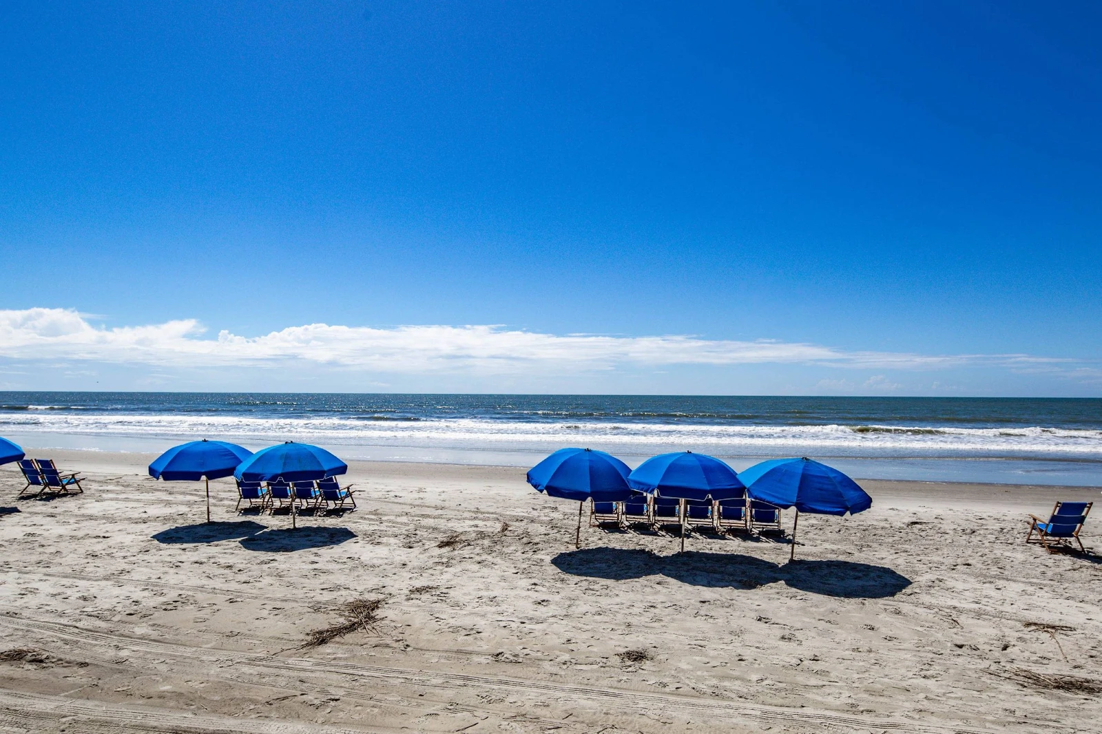 There are beach chairs and umbrellas available for rent.